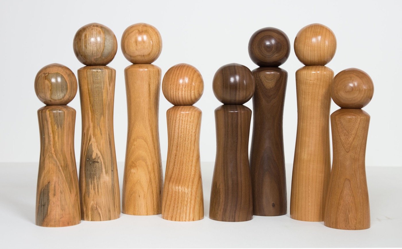 Handcrafted peppermill sets lined up for display